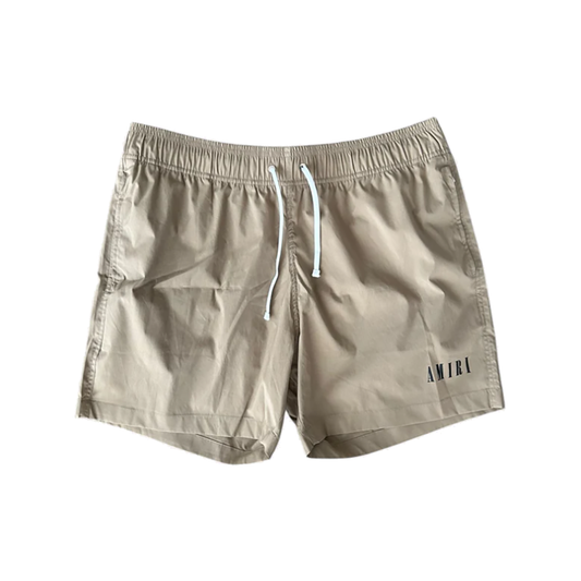 AMIRI CORE LOGO SWIM SHORTS IN TAN
