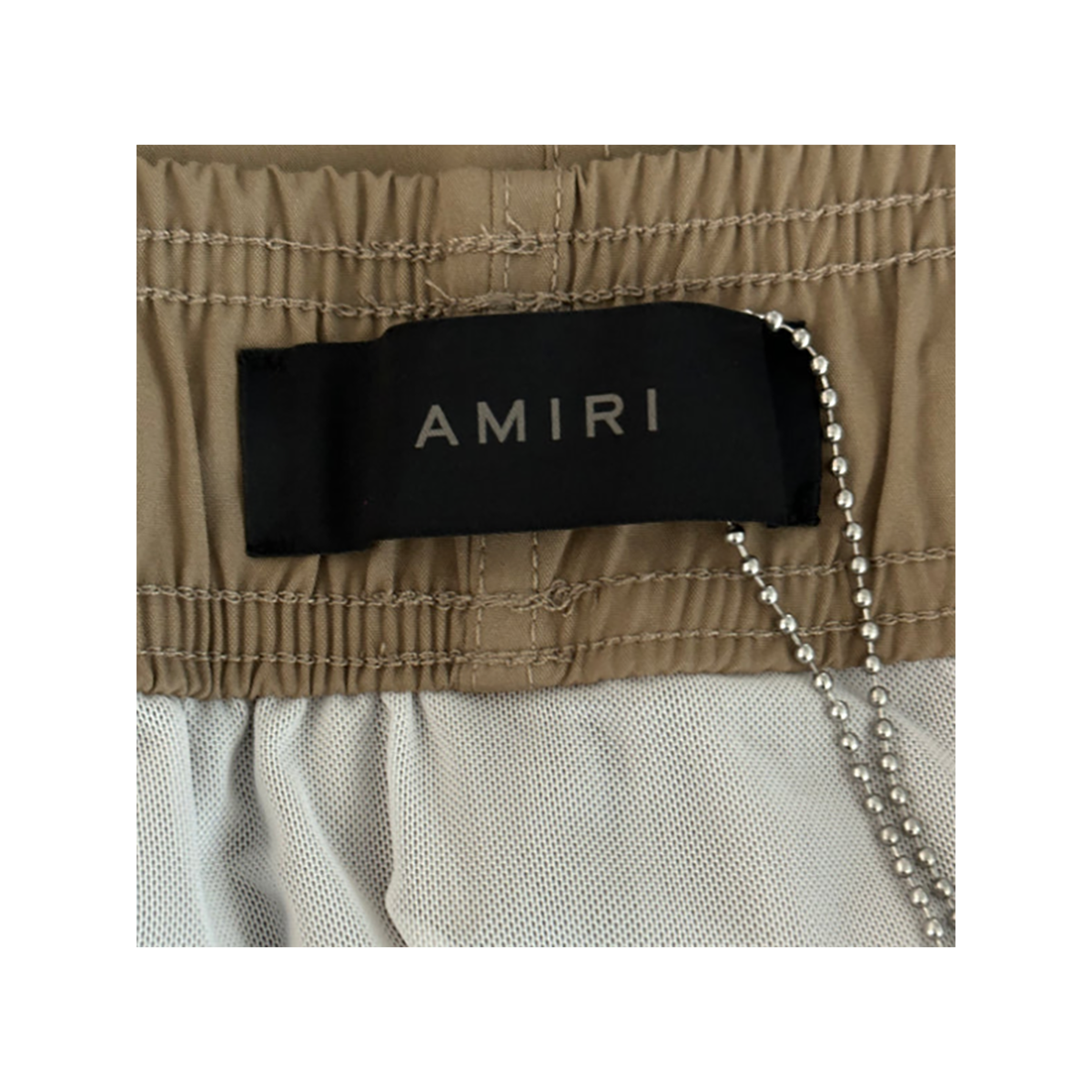 AMIRI CORE LOGO SWIM SHORTS IN TAN