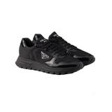 PRADA PRAX 01 RE-NYLON AND BRUSHED LEATHER TRAINERS IN BLACK