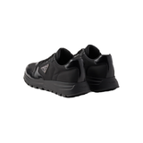 PRADA PRAX 01 RE-NYLON AND BRUSHED LEATHER TRAINERS IN BLACK