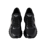 PRADA PRAX 01 RE-NYLON AND BRUSHED LEATHER TRAINERS IN BLACK