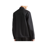 PRADA RE-NYLON LOGO BADGE SHIRT IN BLACK