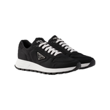 PRADA PRAX 01 RE-NYLON TRAINERS IN BLACK/WHITE