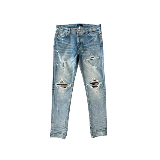 AMIRI CLAY INDIGO AND BROWN PATCH MX1 JEANS