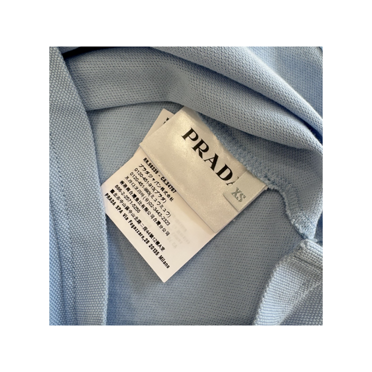 PRELOVED PRADA LOGO BADGE POLO SHIRT IN BABY BLUE